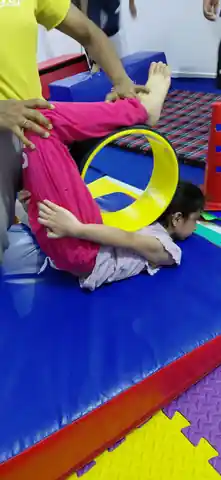 Group of children in a flexibility training class at Kids Activity & Gymnastics Centre, Rajeev Nagar, Patna