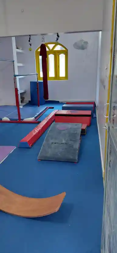 Students in a flexibility and stretch routine during gymnastics class at Rajeev Nagar, Patna