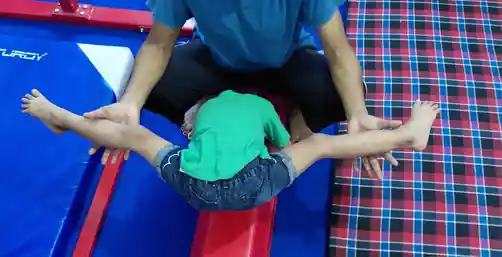 Children in a full gymnastics training session on the floor mat at Rajeev Nagar, Patna