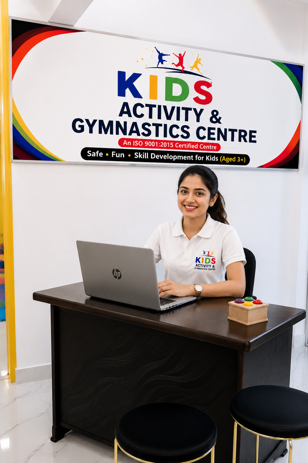 A team member at the Kids Activity & Gymnastics Centre reception desk