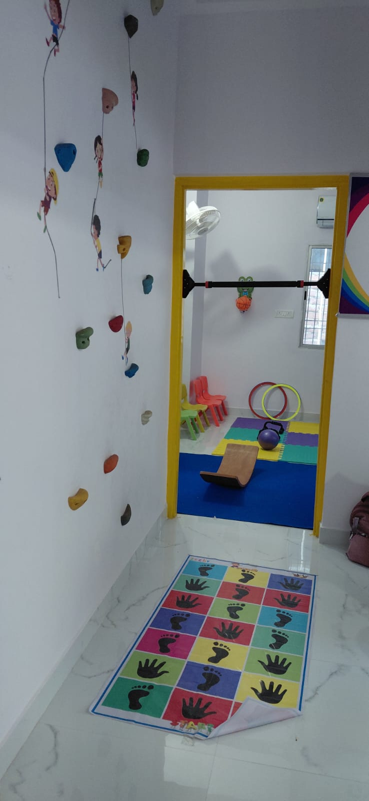 A colourful sensory walkway leading into the centre activity room